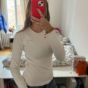 Cream long-sleeve T-shirt by Brandy Melville.